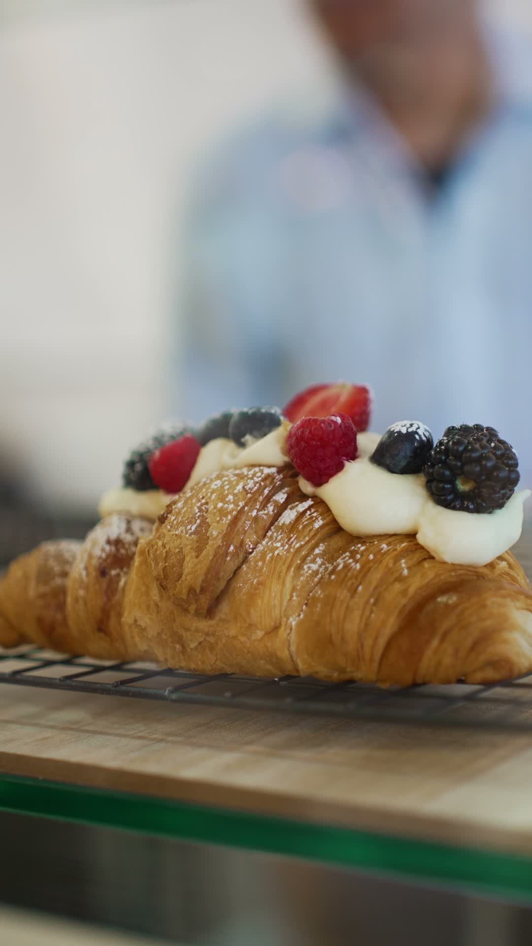 Amalie’s croissant topped with cream and fresh berries, photographed during the Vivid Canvas shoot